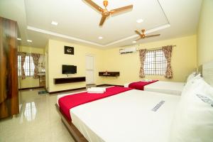 Voodi või voodid majutusasutuse Akash Residency toas