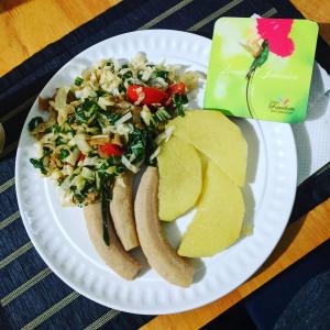 a plate of food with a hot dog and chips at Ultimate Freedom Bed and Breakfast in Santa Cruz