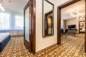 Postel nebo postele na pokoji v ubytování Žilvinas Hotel