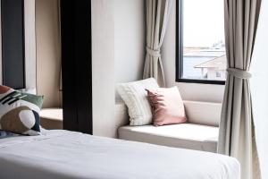Postel nebo postele na pokoji v ubytování Qlosest Hotel