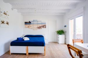 מיטה או מיטות בחדר ב-Suite Milù