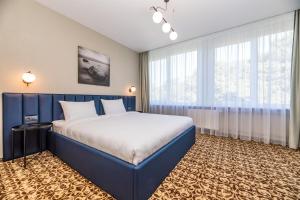 Postel nebo postele na pokoji v ubytování Žilvinas Hotel