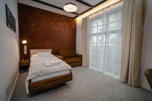 Postel nebo postele na pokoji v ubytování Garni Hotel DOCK Bratislava + 37 fotografií