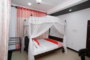 Shirantha Hotel客房内的一张或多张床位