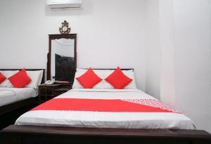 Shirantha Hotel客房内的一张或多张床位