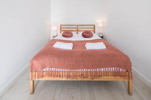 Łóżko lub łóżka w pokoju w obiekcie Piotrkowska Welcome Apartments