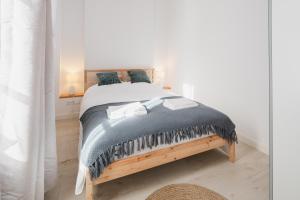 Łóżko lub łóżka w pokoju w obiekcie Piotrkowska Welcome Apartments