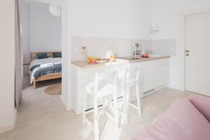 Łóżko lub łóżka w pokoju w obiekcie Piotrkowska Welcome Apartments