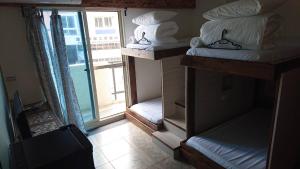 Cama o camas de una habitación en 馬公港精品旅宿包棟烤肉附設租車