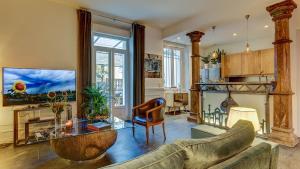 a living room with a couch and a table at Cocoon in Cannes ***** in Cannes