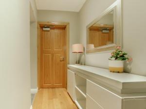 a dressing room with a mirror and a table at Bessemer House Apartments in Attercliffe