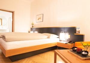 Katil atau katil-katil dalam bilik di Boutique Hotel Hauser