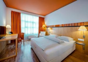 Katil atau katil-katil dalam bilik di Boutique Hotel Hauser