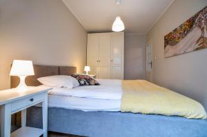 Posteľ alebo postele v izbe v ubytovaní CITYSTAY Piwna Gdansk Apartment
