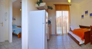 A bed or beds in a room at Agapi Apartments