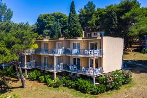 an aerial view of a house with balconies and trees at Arena Verudela Beach in Pula
