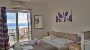 Postel nebo postele na pokoji v ubytování Apartments Nemira
