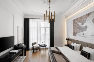 A television and/or entertainment centre at AKKA Lush Hotel Taksim