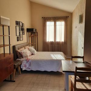 Postel nebo postele na pokoji v ubytování Glicine & more Forlì