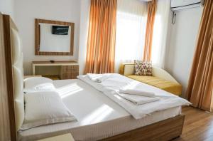 Ένα ή περισσότερα κρεβάτια σε δωμάτιο στο Apart Hotel Llolla