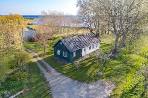an aerial view of a small house on a hill at Strynø Living in Rudkøbing