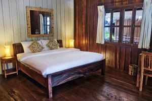 Ein Bett oder Betten in einem Zimmer der Unterkunft Sok San Beach Resort