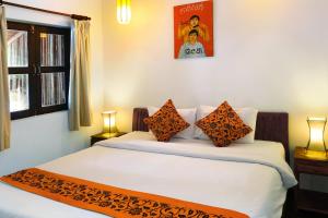Ein Bett oder Betten in einem Zimmer der Unterkunft Sok San Beach Resort