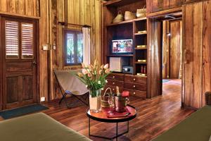 
a living room filled with furniture and a tv at Sok San Beach Resort in Koh Rong Island
