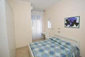 Postel nebo postele na pokoji v ubytování Hotel Maré - Valentini Family Village