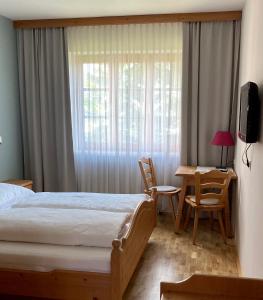 Postel nebo postele na pokoji v ubytování Zöchbauer Gästehaus - Hotel Garni