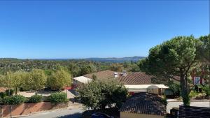 arial view of a town with trees and buildings at Appartement Les Restanques du Golfe de Saint-Tropez in Grimaud