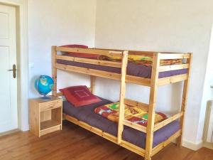 a bunk bed room with two bunk beds at Gîte Léonline sur les hauteurs de Masevaux -au pied des Vosges in Masevaux