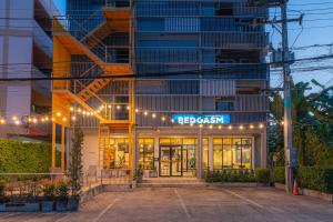 a building with a sign that reads bergbush at BEDGASM Hotel x Cafe Nimman in Chiang Mai