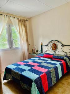 Кровать или кровати в номере La casita de Jimena