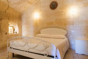 Katil atau katil-katil dalam bilik di La Corte Dei Pastori