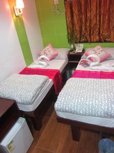 Ένα ή περισσότερα κρεβάτια σε δωμάτιο στο Marrigold Hostel