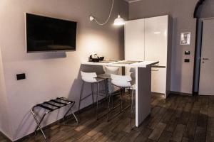 TV a/nebo společenská místnost v ubytování Aparthotel Meneghino