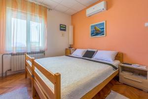 Postel nebo postele na pokoji v ubytování Apartment Antic S