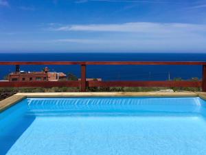 a swimming pool with a view of the ocean at Rincón del Mar , Espacio Natural in La Orotava