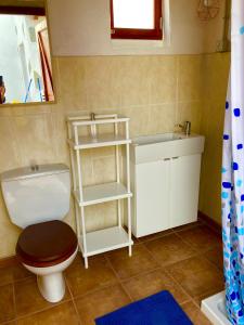 a bathroom with a toilet and a sink at Rincón del Mar , Espacio Natural in La Orotava +40 photos
