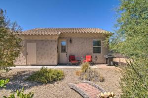 a small house with two chairs and a patio at Cave Creek Casita with Fire Pit 5 Mi to Town and Golf in Cave Creek