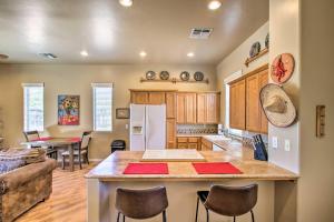 a kitchen and dining room with a large island in a room at Cave Creek Casita with Fire Pit 5 Mi to Town and Golf in Cave Creek