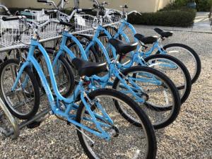 a group of blue bikes parked next to each other at Villa Renaissance Unit 501 Grace Bay Beach in The Bight Settlements