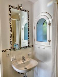 a bathroom with a sink and a mirror at Ferien auf der Burg in Niebüll