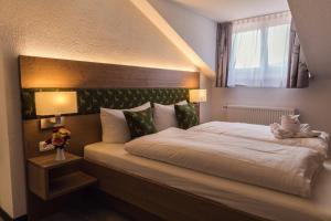 Postel nebo postele na pokoji v ubytování Waldhotel Seebachschleife + 29 fotografií