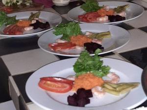a group of plates of food on a table at Campement Sindéye in Abémé