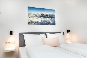 a hotel room with a bed and a ski lift at Souterrain Apartment Flachau in Flachau