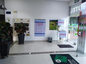 a room with a store with a plant in it at Hotel Aguazul Plaza Centro in Aguazul