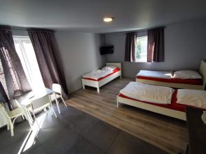 Giường trong phòng chung tại Hotel Engelsburg - Apartments