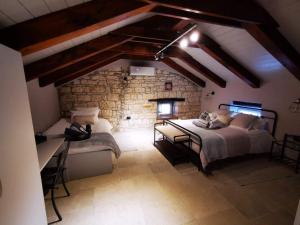 Postel nebo postele na pokoji v ubytování Casa della Grofica